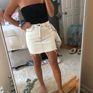 White denim skirt with black stitching